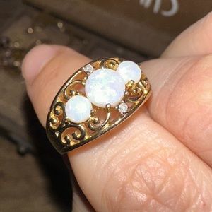 10k Gold 3 Opal ring with two small diamonds size 7